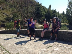 Resting on medieval bridge over the rio Arga